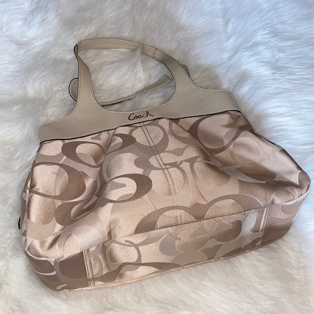 Cream colored Coach logo purse